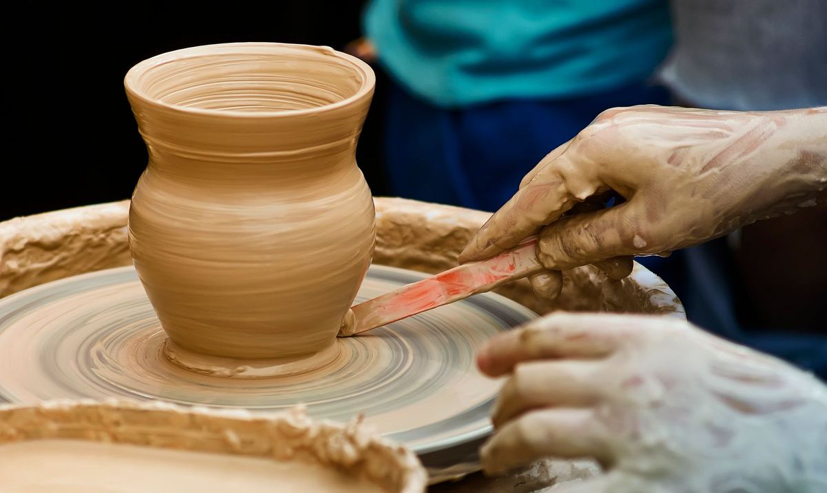 Trimming a freshly thrown clay vase