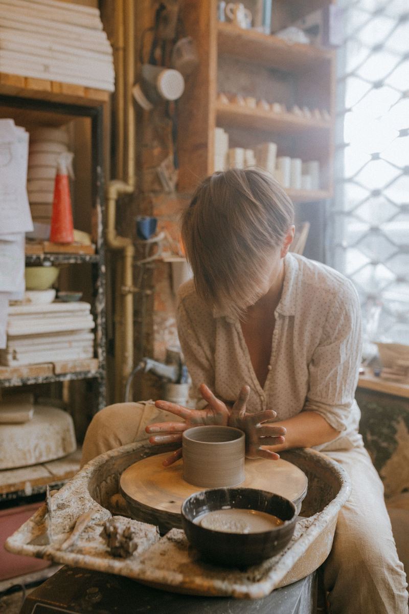 Centering clay on the wheel in the studio