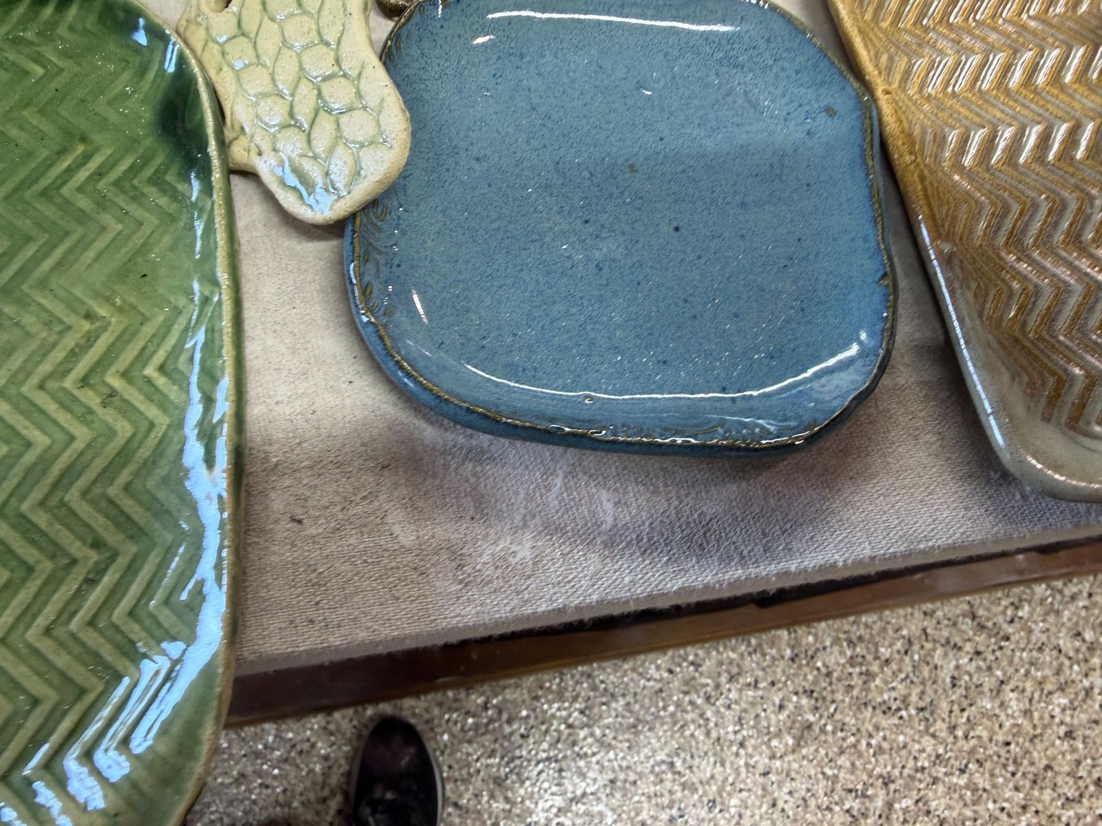 Glazed handbuilt plates with stamped chevron and leaf textures